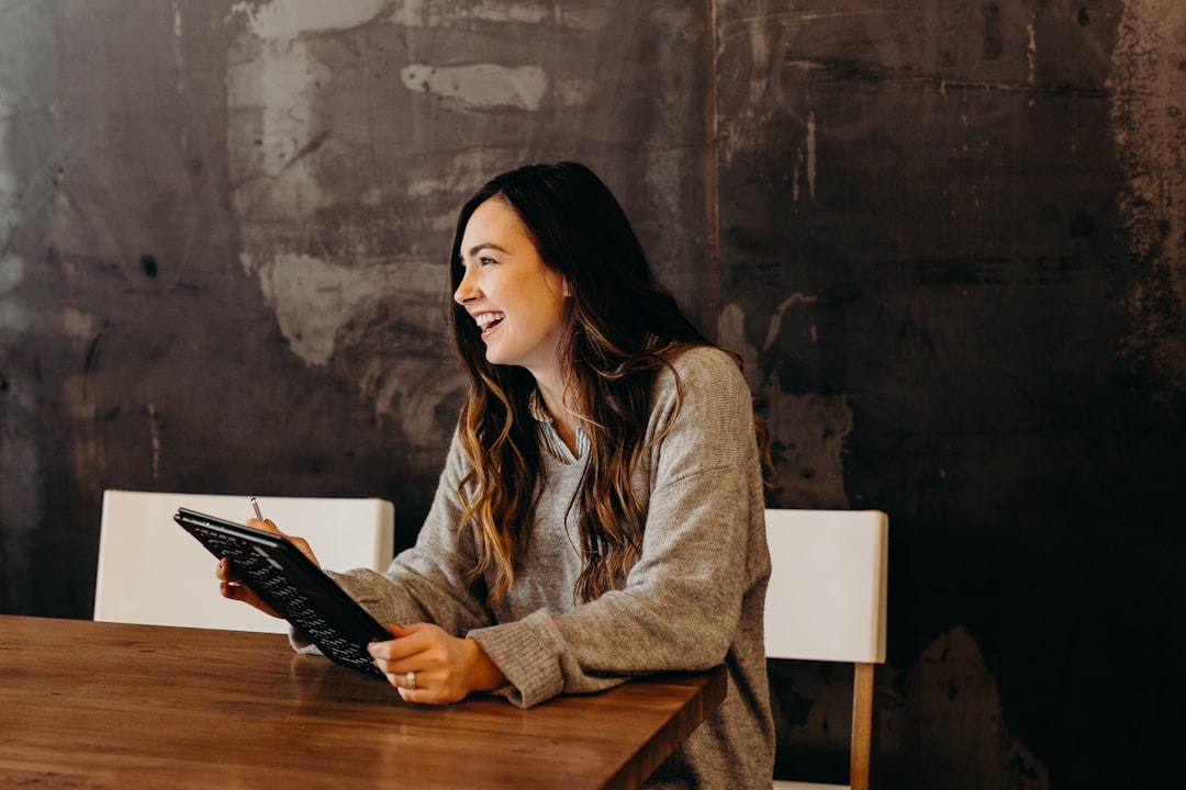 A professional reviewing co-working desk membership options at a shared workspace in London