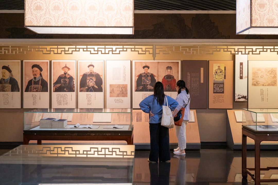 A parent and teenager walk through a gallery together at one of London's children's museums