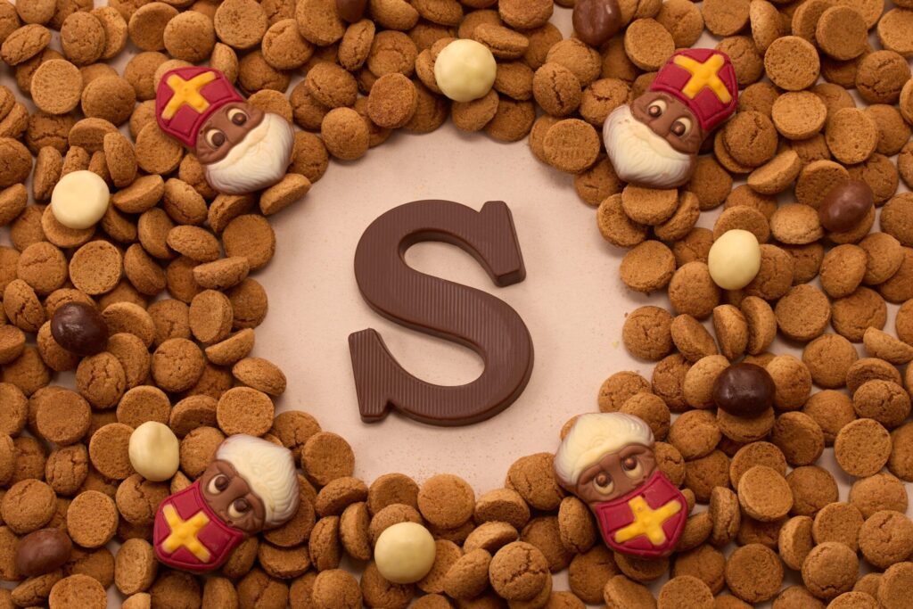 Traditional St Nicholas chocolate treats and European holiday cookies displayed on festive table