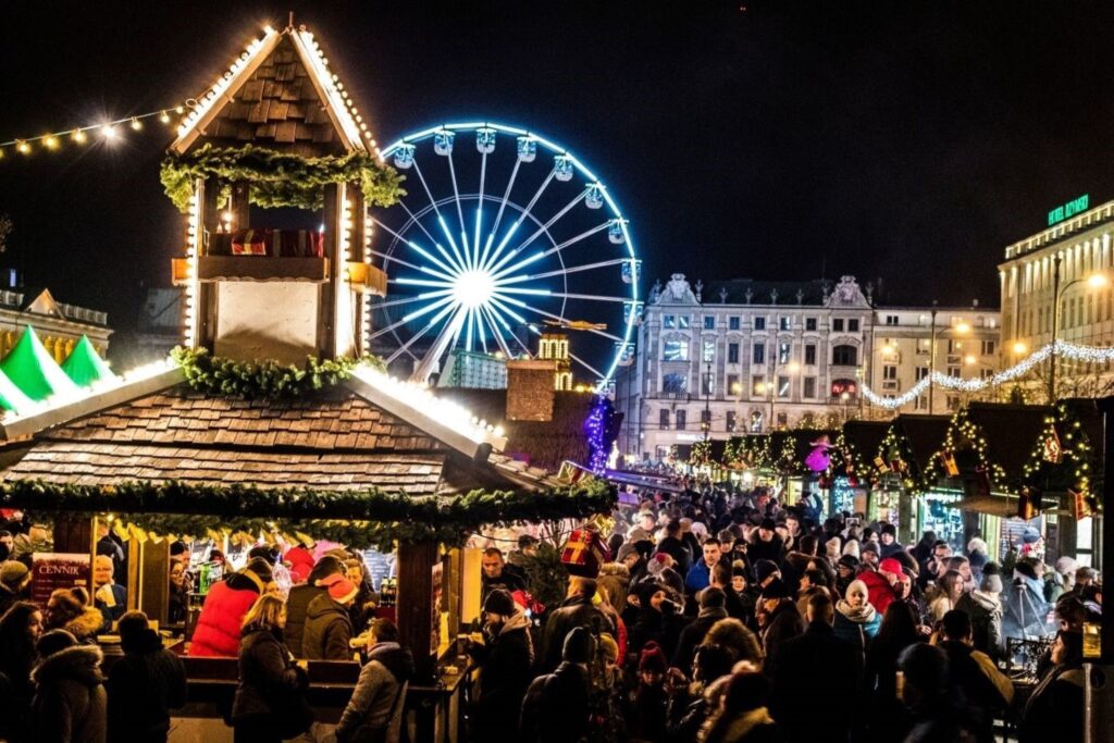 Brussels Winter Wonders Christmas markets illuminating historic Grand Place with giant Ferris wheel and wooden chalets, showcasing Belgium's festive celebrations as top-ranked European holiday destination