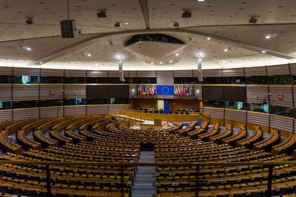 European Parliament hemicycle chamber representing EU democratic integration and economic progress in 2026