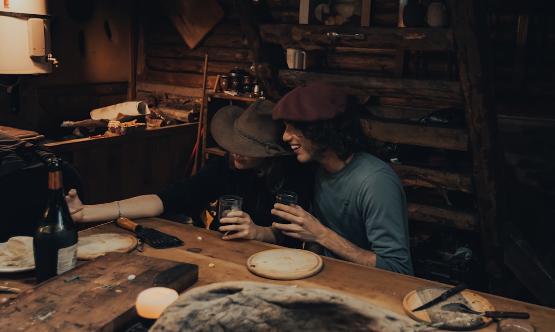 A couple explores EU wines paired with local aged cheeses during a tasting in a stone wine cellar