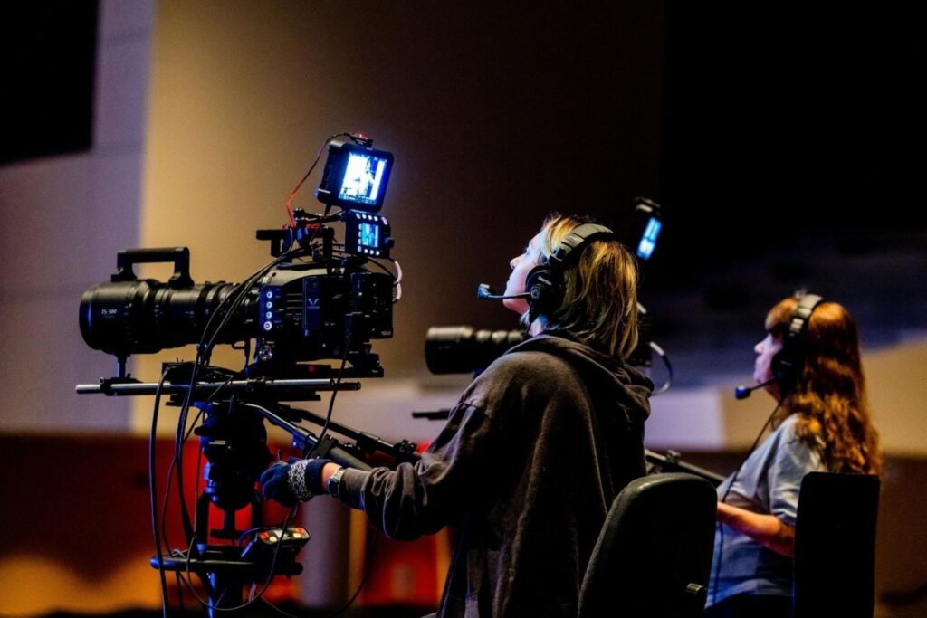 Film industry director with clapperboard showing Indian content production and entertainment investment
