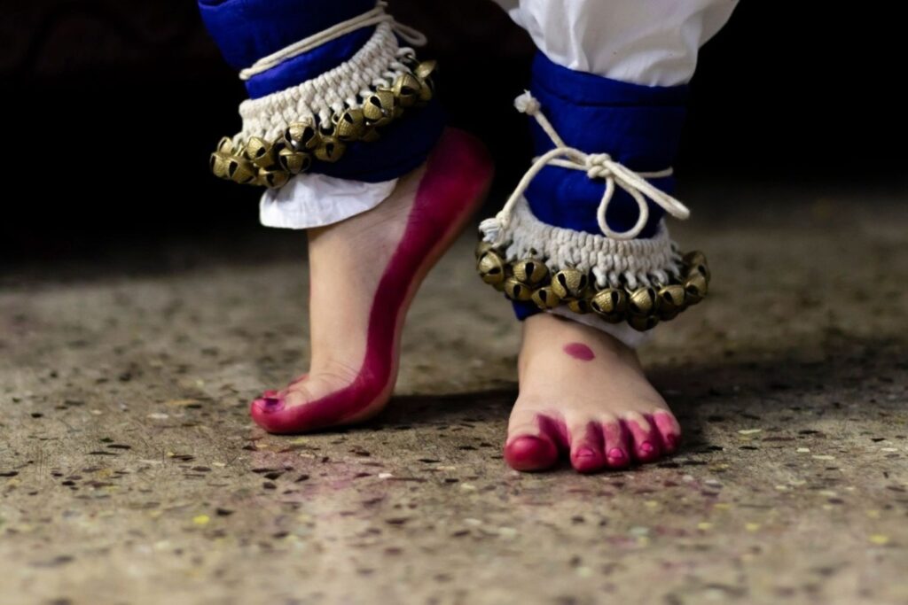 Classical arts dancer feet with traditional ghungroo ankle bells showing Indian dance heritage and cultural accessories