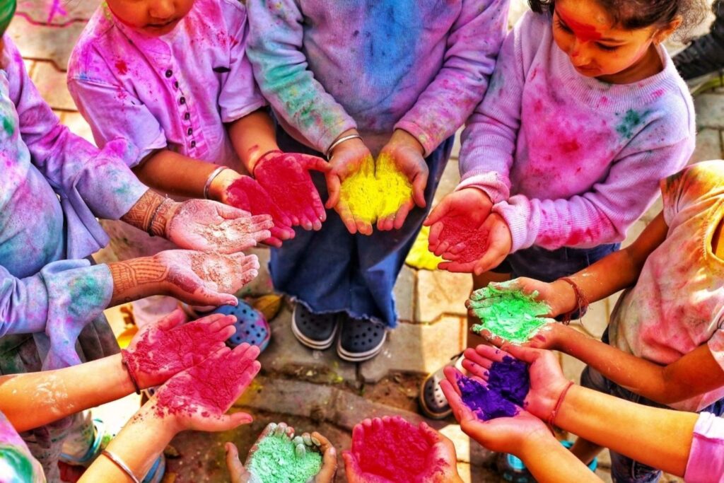 Holi festival colors being thrown showing India's vibrant celebration and travel destination experiences