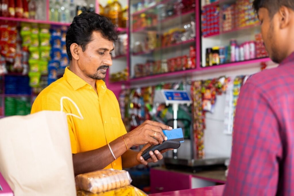 Cashless digital payment transaction at an Indian market demonstrating the scale of India's digital payments transformation