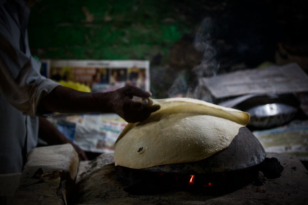 A home cook in India working with gluten-free flours including millet and besan to make roti dough