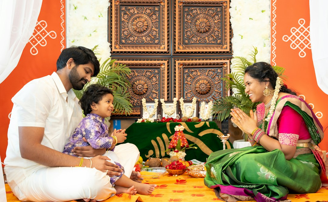 An Indian family performs puja together at a temple during Navratri celebrations in their city